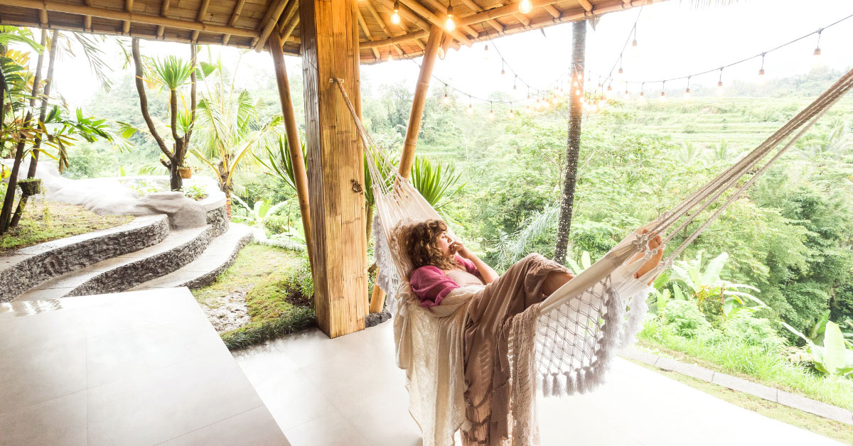 woman in hammock in tropical location