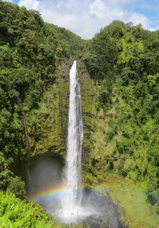 waterfall coming from mountain in hawaii