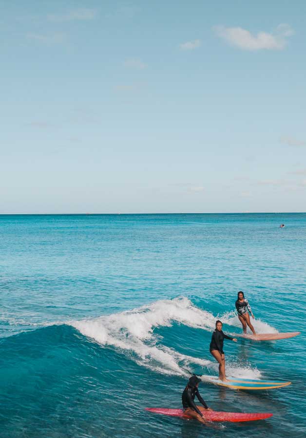 surfers in hawaii