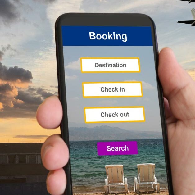 person on their phone booking a vacation